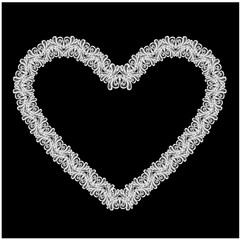Fototapeta na wymiar White Heart shape is made of lace doily isolated on black backgr
