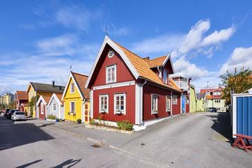 Fototapeta na wymiar Row of ancient colorful wooden houses in the city of Karlskrona, Sweden