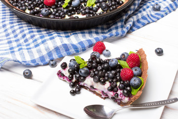 Delicious tart with blueberries and raspberries