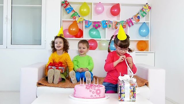 A group of children at a birthday party.Slow motion, high speed camera