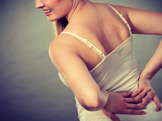 Woman suffering from back pain