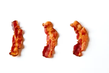 Küchenrückwand glas motiv Three Slices of Bacon Isolated on a White Background © rondakimbrow