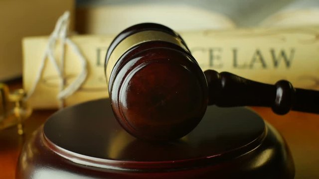 Court house gavel magistrate judge pronouncing a divorce settlement