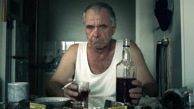Depressed adult male person drinking alcohol suffering effects of alcoholism and loneliness 