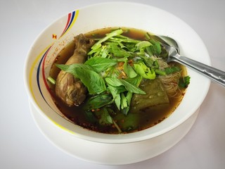 Chicken noodle in white bowl
