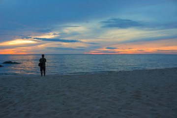 Fototapeta na wymiar Sunrise morning time before, cameraman on the beach.