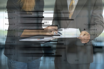 Businessman and woman talking about financial report in office.Double exposure.