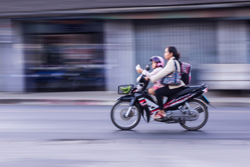 Fototapeta premium motorcycle panning in road, Asia