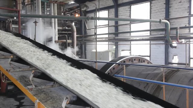 Processing Sugar Beet in Sugar Refinery.Industry exterior Pipeline, Excavator. 