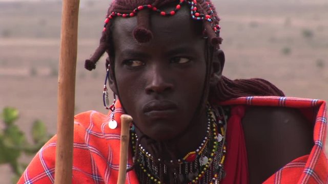 Portrait Masai Warrior dressed in his traditional clothing