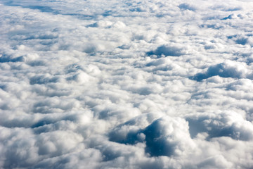 Close up view of fluffy clouds over a blue sky