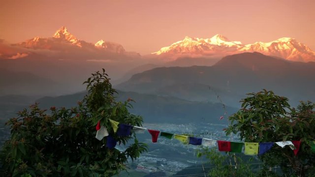 Sunrise in the beautiful mountain landscape Himalayas, colorful praying flags