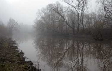 Springtime.Misty landscape with river.
