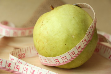 Guava fruit with a tape measure