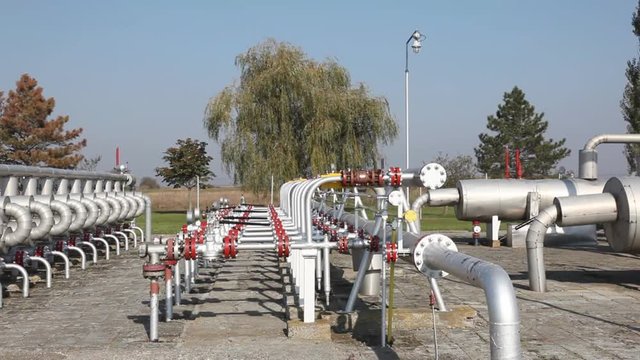 Underground storage of natural gas. Factory distribution, and industrial processing of natural gas with Worker. Many pipelines and construction.