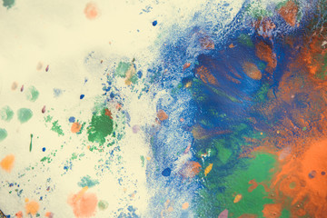 Multicolored paint stains, drips, splashes, mixing. Abstract background