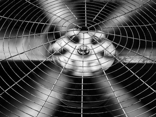 Fototapeta Black and white of HVAC (Heating, Ventilation and Air Conditioning) spining blades / Closeup of ventilator / Industrial ventilation fan background / Air Conditioner Ventilation Fan obraz