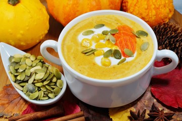spicy pumpkin soup in a white bowl, selective focus
