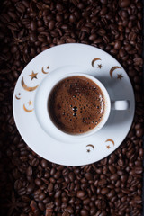 Turkish coffee on coffee beans background