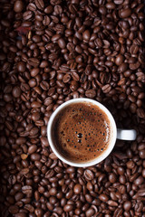Turkish coffee on coffee beans background