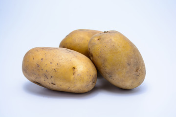 Raw potato on white background isolated.
