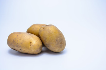 Raw potato on white background isolated.