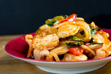 wok fried chicken stir fry with sweet peppers and chinese vegeta