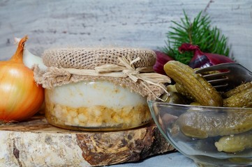 lard and cracklings in a jar, onion and cucumber
