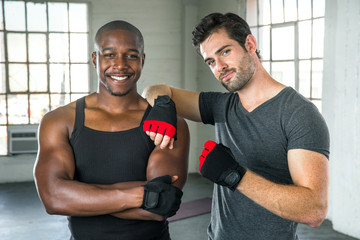 Handsome men pose after exercise fitness class mixed martial arts training instructor