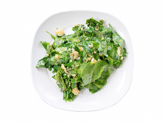 Stir fried Gnetum gnemon or Melinjo with egg in white plate isol