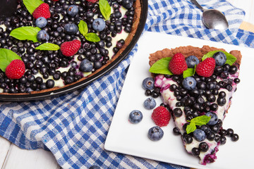 Delicious tart with blueberries and raspberries