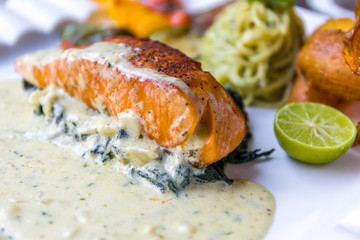 Grilled Salmon Fillet with Spinach and White Sauce