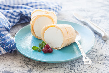 ice cream in a wafer cup on a plate, selective focus