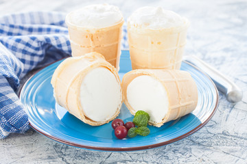 ice cream in a wafer cup on a plate, selective focus