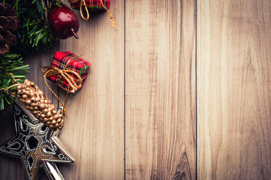 Christmas tree with decoration on wooden background