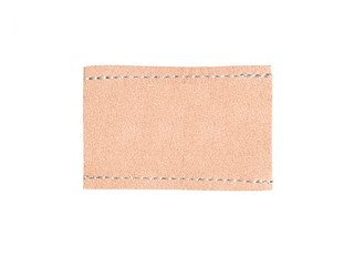 Brown leather tag label with seam isolated on white background.