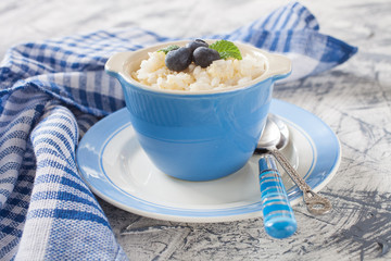 millet rice porridge in a bowl on a table, selective focus