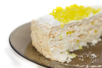 Layered cake with slices of lemon jelly closeup