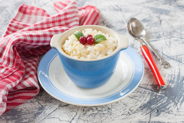 millet rice porridge in a bowl on a table, selective focus