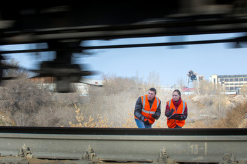 Obraz premium Railroad workers maintaing railways