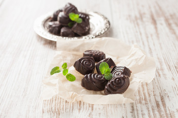 chocolates on paper  on a table, selective focus