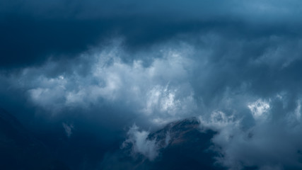 The night cloud on the background of the mountain. Wide angle