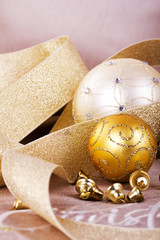 Festive gold Christmas decorations on fabric background
