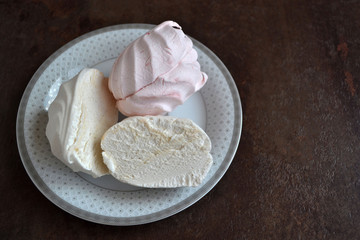 Zephyr (marshmallows) cut into pieces. Texture of dessert.It is made by whipping fruit and berry puree (mostly apple puree) with sugar and egg whites with subsequent addition of a gelling agent.