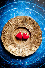 red hearts over gold zodiac like a conceprt for astrology and love, zodiac symbols and relationship
