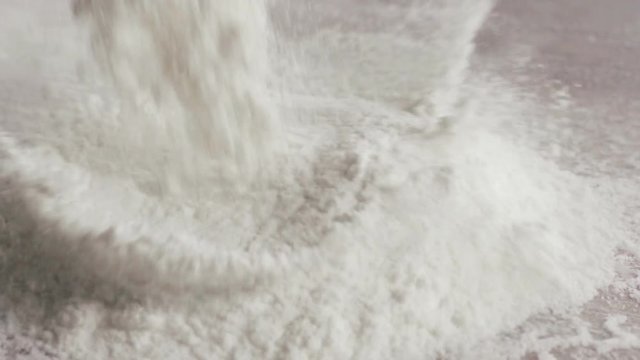 Scattered dry flour on a kitchen counter top