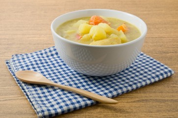 Vegetable Soup with Potato and Tomato in White Bowl