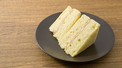 Vanilla Chiffon Cake on A Black Dish