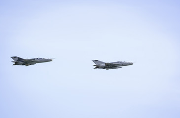Fototapeta Military jets mig-21 on blue sky background obraz