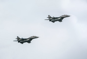 Two fighter jets mig-29 on blue sky background
 - obrazy, fototapety, plakaty